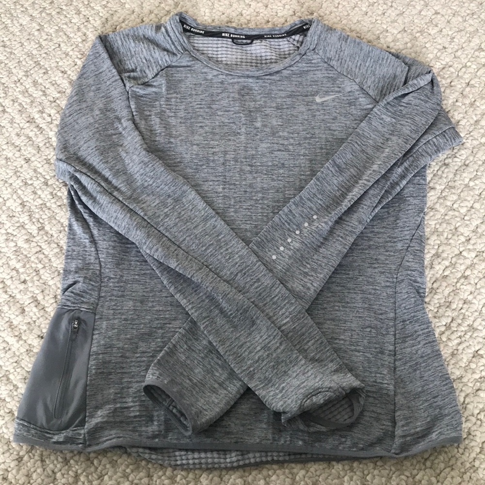 Nike long sleeve running shirt with side pocket.